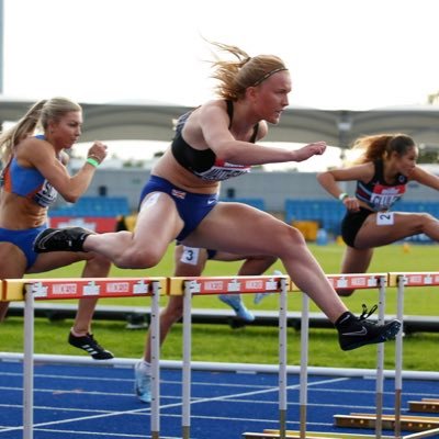 Lucy Matthews competing in hurdles
